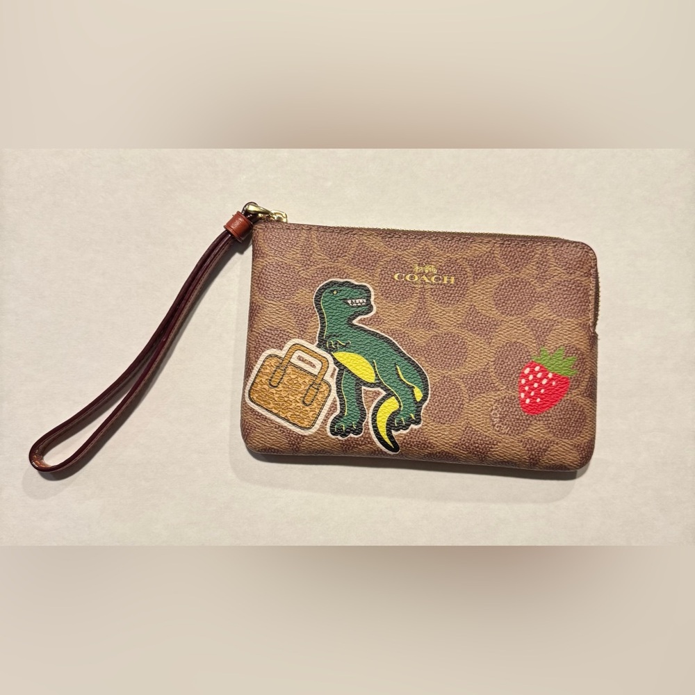 Coach Dinosaur RWAR Wristlet with Gold Accents
